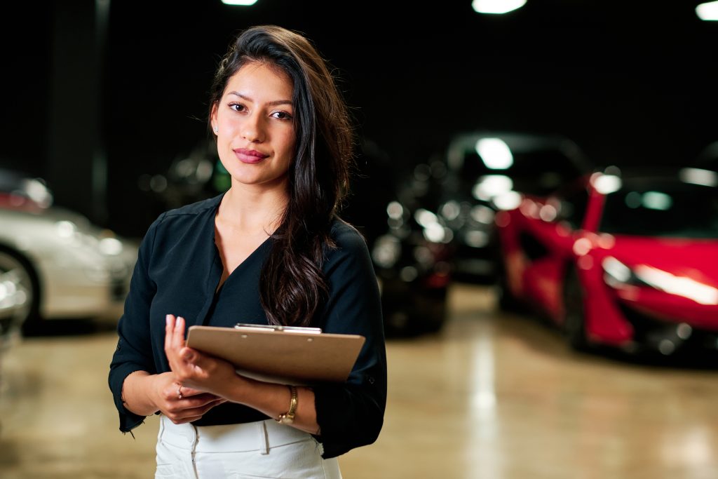 Young woman selling luxury cars | Featured Image for the blog on Selling Luxury Cars from Sell My Car Queensland